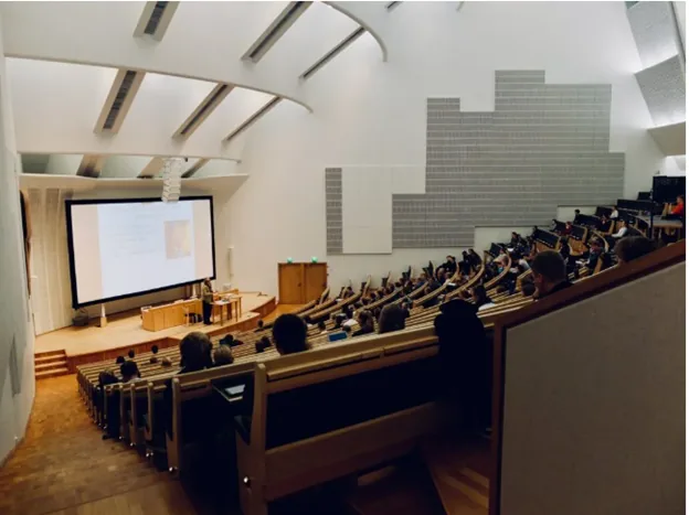 Students seated in a tiered lecture hall at Northwestern University